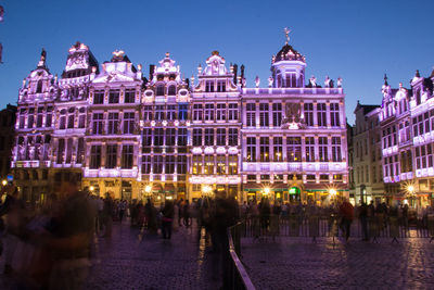 Group of people in front of building at night