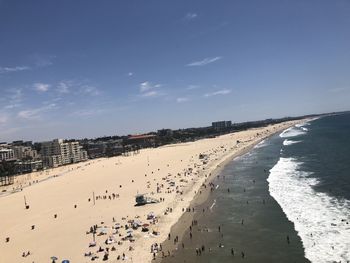 High angle view of crowd on beach against sky