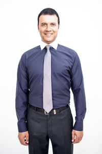 Portrait of a smiling young man against white background