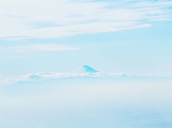 Scenic view of snowcapped mountain against sky