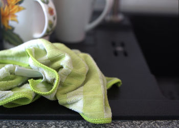 Close-up of green leaf on table