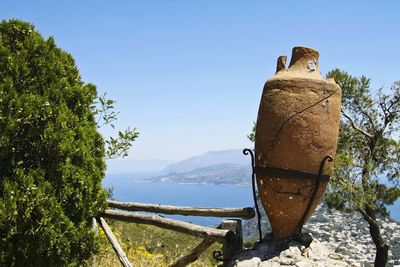 Horse cart on mountain against clear sky