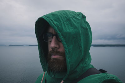 Portrait of man in sea against sky