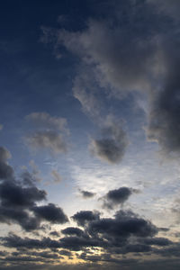 Low angle view of cloudy sky during sunset
