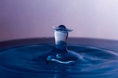 Close-up of drop falling in water