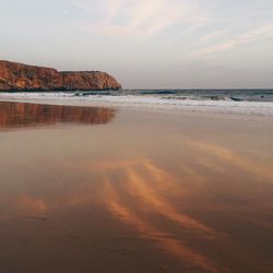 Scenic view of sea against sky at sunset