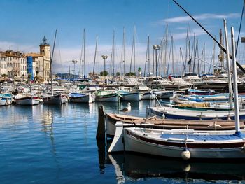 Boats moored at harbor