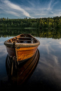 Old row boats at silkeborg lake at sunset