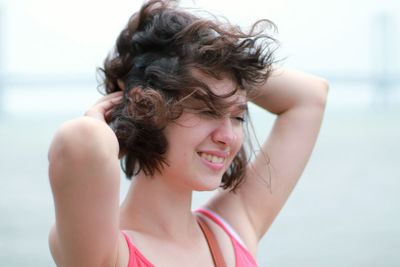 Portrait of smiling woman on beach