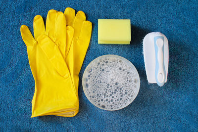 High angle view of yellow shoes on table