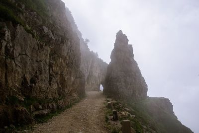 Rock formations on mountain against sky