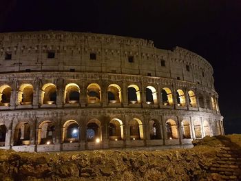 Low angle view of historical building at night