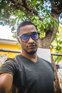 Portrait of young man wearing sunglasses