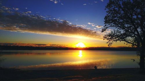 Scenic view of lake at sunset