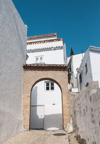 Low angle view of building against clear blue sky