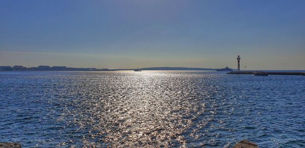 Scenic view of sea against blue sky