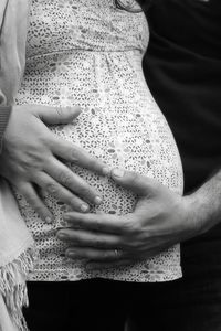 Close-up of hands holding baby feet