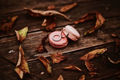 Close-up of macaroons and rings on deck