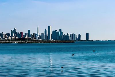 Scenic view of sea against blue sky