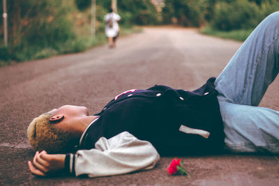 Midsection of man sleeping on sofa