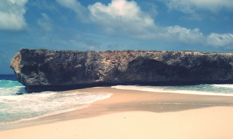 beach, sea, sand, shore, water, sky, scenics, tranquility, tranquil scene, wave, beauty in nature, surf, coastline, horizon over water, nature, idyllic, rock formation, vacations, tide, day