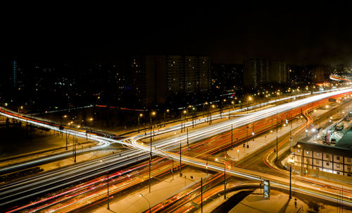 High angle view of light trails on road at night