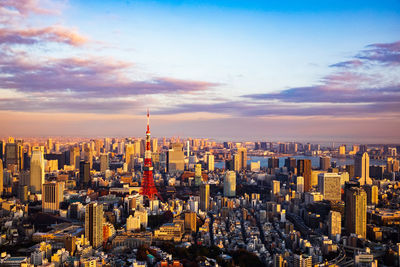 Aerial view of city buildings during sunset