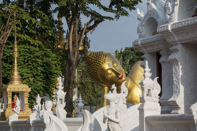 Statue against temple outside building