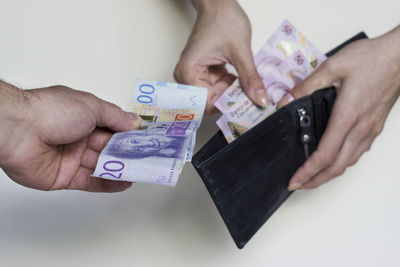 Close-up of hand holding tattoo