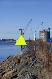 Sign with yellow triangle for shipping at port