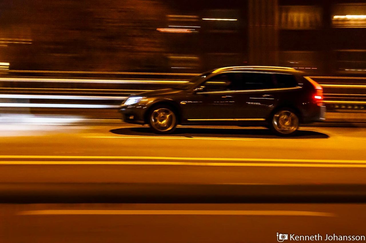 transportation, land vehicle, mode of transport, car, night, blurred motion, illuminated, street, speed, motion, on the move, travel, road, yellow, headlight, outdoors, bicycle, stationary, long exposure, no people