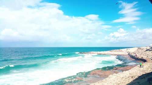 Scenic view of sea against cloudy sky