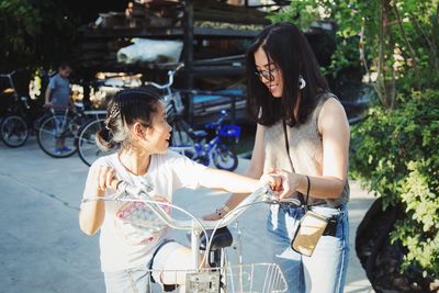 Women holding bicycle