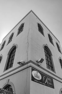 Low angle view of clock tower against sky