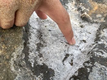 Low section of person on rock