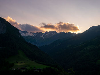 Scenic view of mountains against sky during sunset