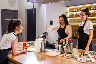 Female friends sitting at table