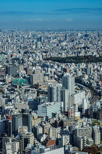 Aerial view of cityscape against sky