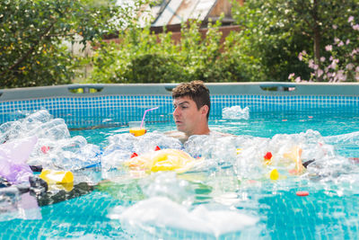 Full length of boy swimming in pool