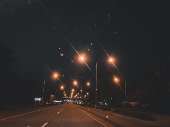 Cars on road at night