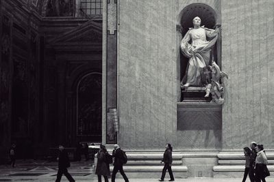 Statue in front of building