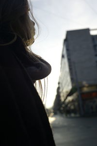 Rear view of woman looking at city