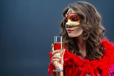 Portrait of woman holding red wine