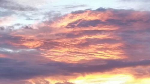 Low angle view of dramatic sky during sunset