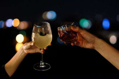 Close-up of hand holding wine glass