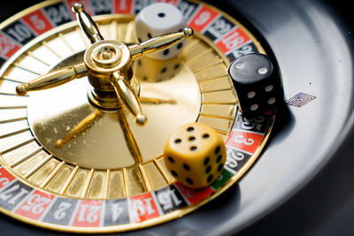 Close-up of dice on roulette wheel in casino