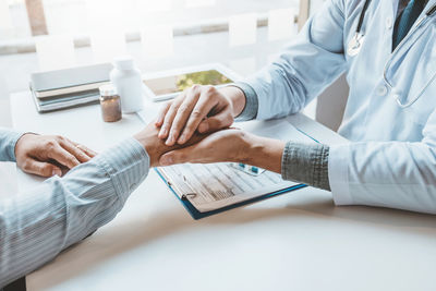 High angle view of people on table