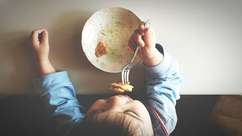 Midsection of man eating food