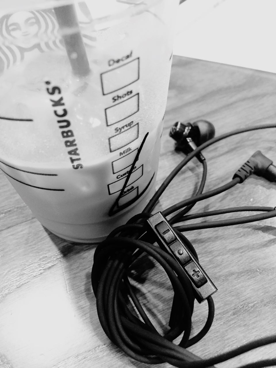 indoors, text, western script, communication, high angle view, still life, close-up, table, no people, technology, paper, single object, drink, number, day, food and drink, glass - material, focus on foreground, refreshment, book