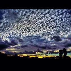 Scenic view of landscape against cloudy sky